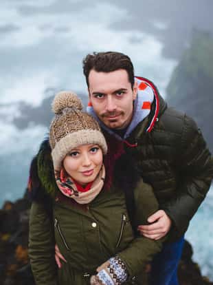 portrait of couple on hill by sea