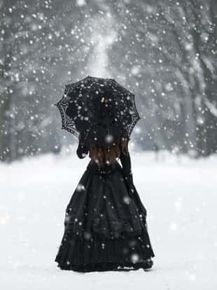 Mysterious lonely woman in Victorian dress departing into the distance