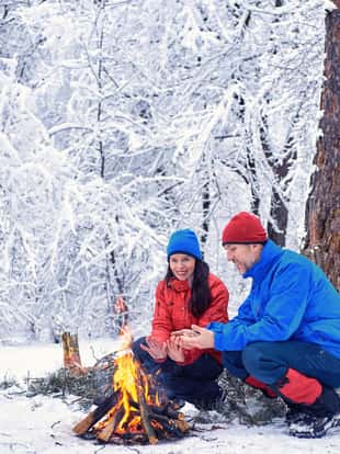 Camping in the winter forest of a couple in love.