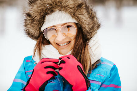 Beautiful young woman enjoying winter