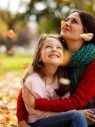 Mother and daughter playing in the park