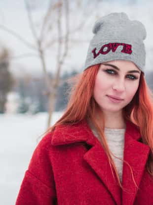 Portrait of young woman in winter park.