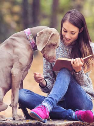 Girl with a dog in the park