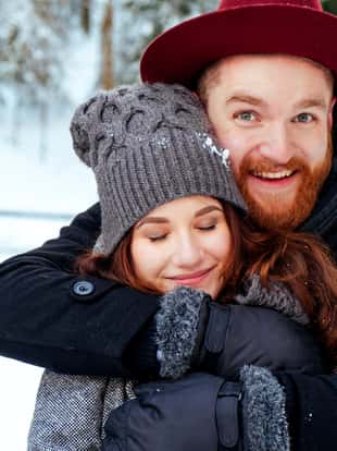 Portrait of a loving couple on a winter background beautiful couple in love.