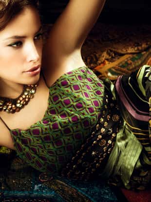 beautiful brunette woman in oriental style clothes, studio shot