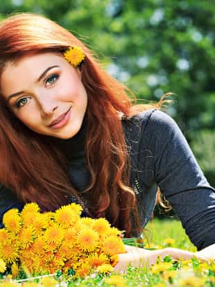 Romantic young woman outdoors at a summer day.