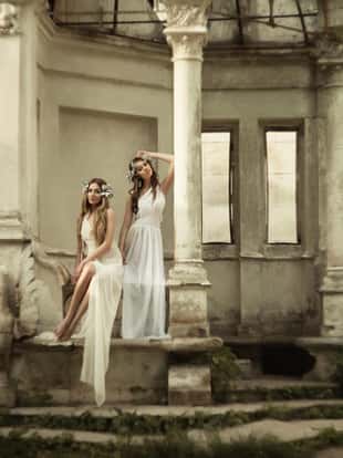 Two young attractive beautiful blonde woman in greek style.  grain and texturer added