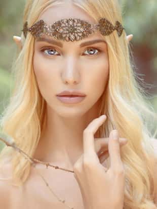 beautiful elf girl. fantasy young woman in woods