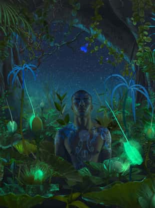 Black man with luminosity tattoo meditation in night jungle