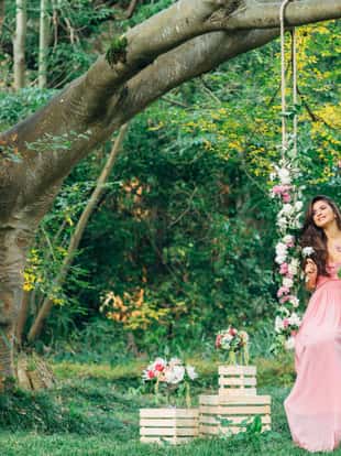 Beautiful young girl on a swing
