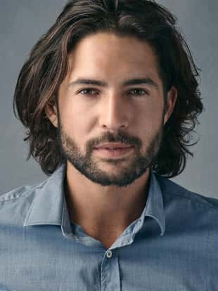 Cropped shot of a handsome young man posing against a grey background